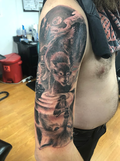 Find tattoo ideas between breast for your next unique tattoo in Ogden at Unhinged Tattoos & Piercing