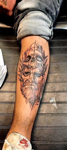 Explore santa tattoo ideas, creative tattoo ideas in Denver, available at Viva La Raza Tattoo Club