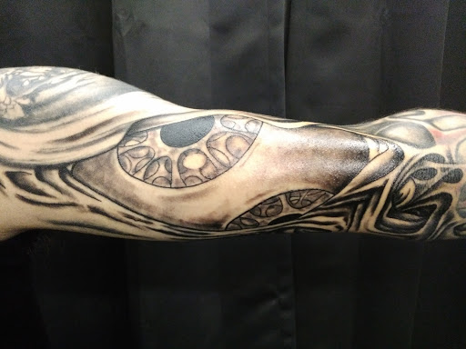 Explore tattoo ideas back of neck, creative tattoo ideas in Bowling Green, available at The Mad Tatter, L.L.C.
