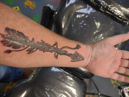 Tattoo Shop «Confessions of the Hand tattoo art gallery», reviews and photos, 2100 E Osceola Pkwy, Kissimmee, FL 34743, USA