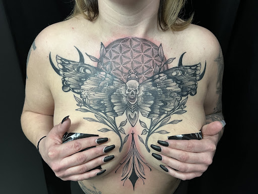 Explore broken heart tattoo ideas, creative tattoo ideas in Avon, available at Altered Image Tattoo and Piercing Studio