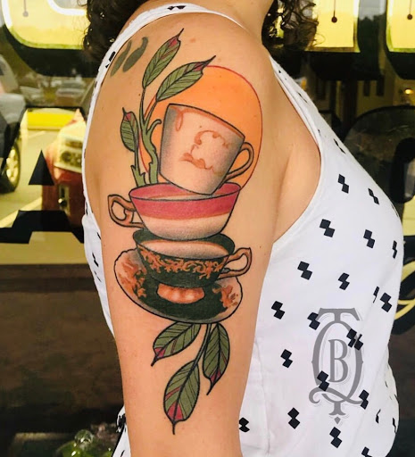 Explore ear tattoo ideas for women, creative tattoo ideas in Marietta, available at The Queen Bee Tattoo and Piercing Parlour