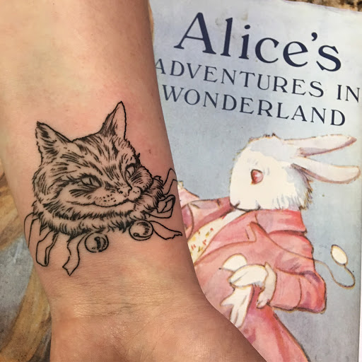 Explore rock and roll tattoo ideas, creative tattoo ideas in Danbury, available at Mad Hatter Tattoo