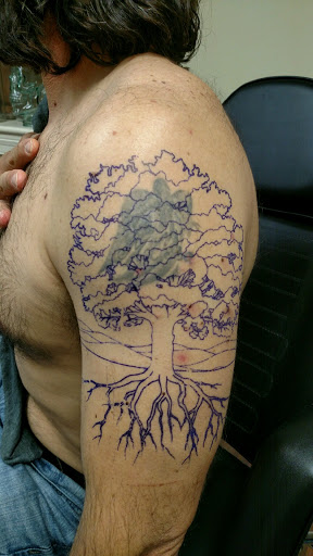 Explore tattoo ideas graffiti, creative tattoo ideas in Wake Forest, available at Revelation Ink Tattoo and Piercing