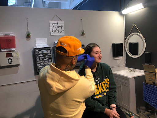 Find boyfriend name tattoo under breast ideas for your next unique tattoo in Fort Wayne at Grade A Tattoos and Body Piercing