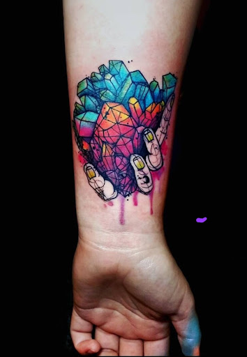 Explore women's arm tattoo ideas, creative tattoo ideas in Benton, available at Spectrum Tattoo