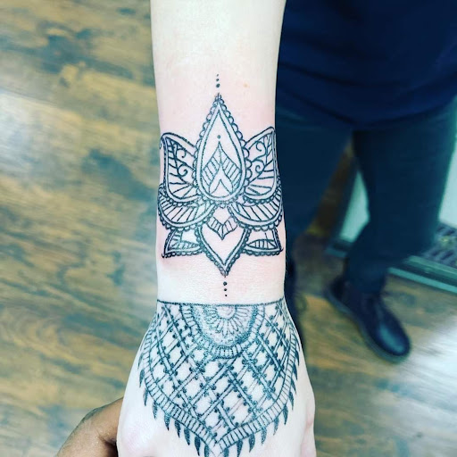 Find joker tattoo ideas for your next unique tattoo in Warren at Aces Tattoo & Body Piercing