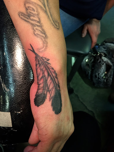 Explore spina bifida tattoo ideas, creative tattoo ideas in Reno, available at Aces Tattoo