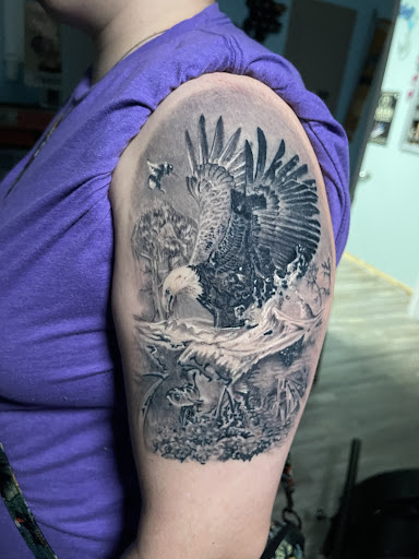 Explore wolf neck tattoo ideas, creative tattoo ideas in Ocala, available at The Tattoo Gallery of Ocala LLC