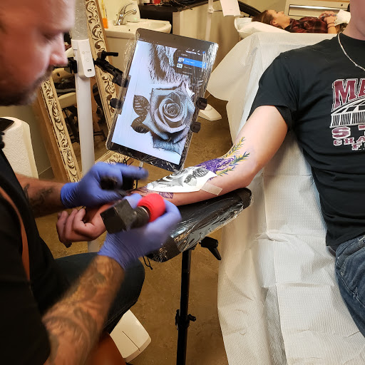 Explore tribal dragon tattoo ideas, creative tattoo ideas in Tea, available at Red Arbor Tattoo