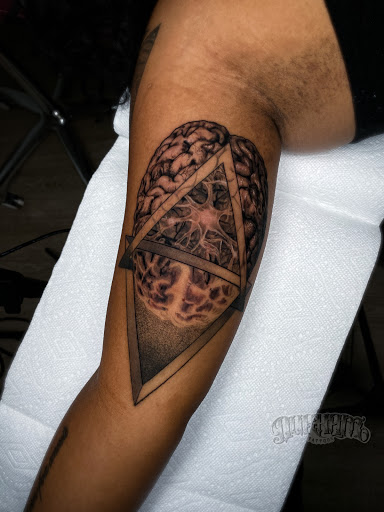 Explore skeleton hand tattoo ideas, creative tattoo ideas in Chapel Hill, available at Durham Tattoos