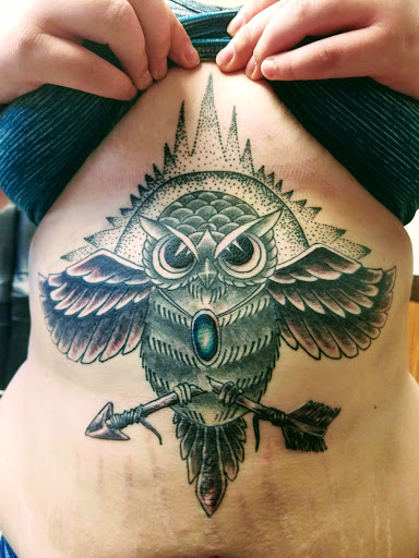 Explore brass knuckle tattoo ideas, creative tattoo ideas in Johnstown, available at Screaming Needle Tattoo & Body Piercing