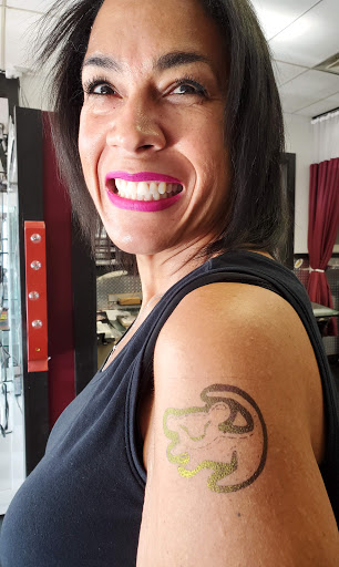 Explore upper arm tattoo ideas for guys, creative tattoo ideas in Hilliard, available at 22 Caliber Tattoo Mega Studio