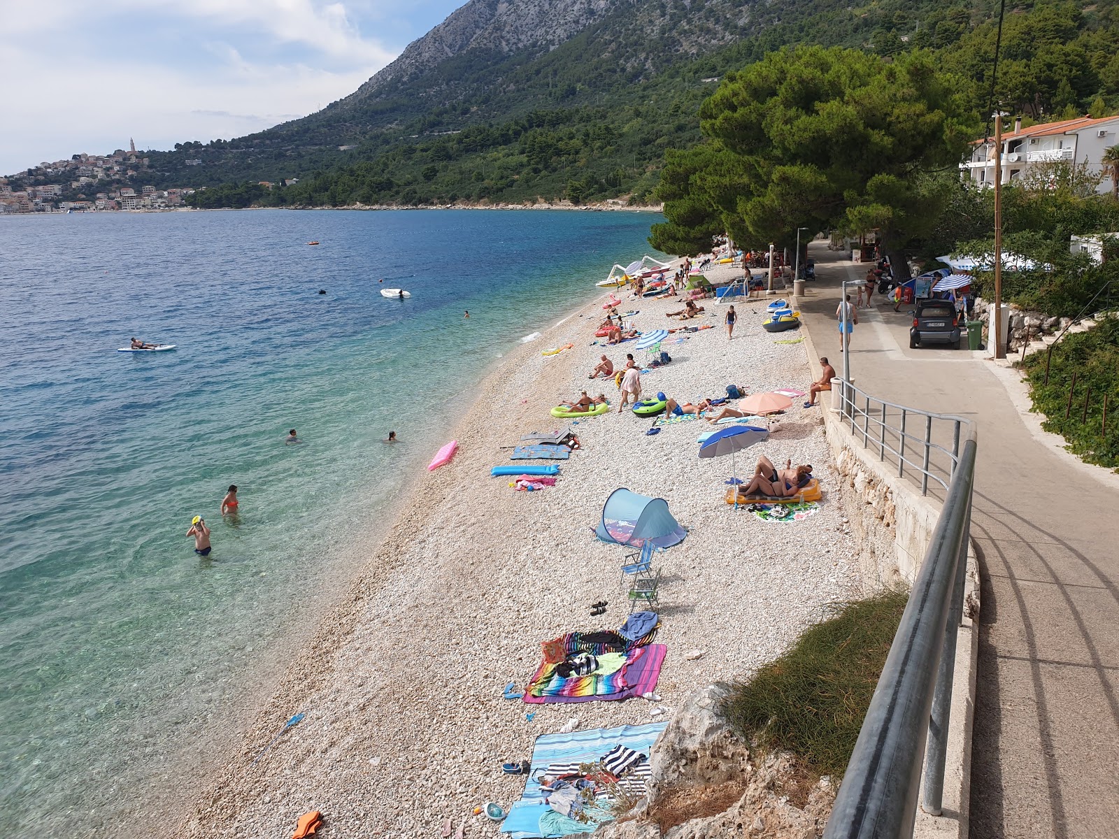 Foto di Porat beach con una superficie del ciottoli beige