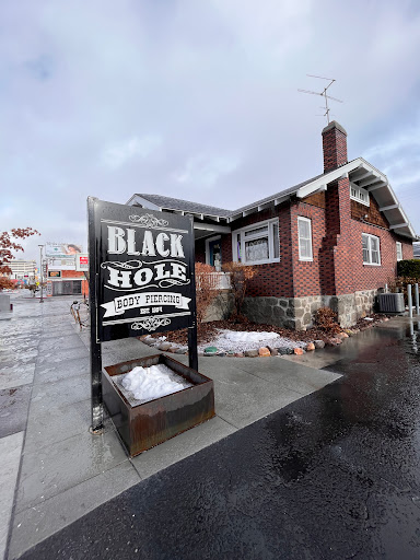 Explore breast cancer ribbon tattoo ideas, creative tattoo ideas in Reno, available at Black Hole Body Piercing