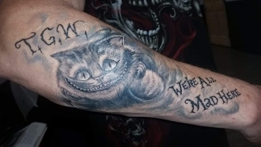 Explore tattoo ideas for football, creative tattoo ideas in Hudson, available at Synchronicity Tattoo Studio Llc