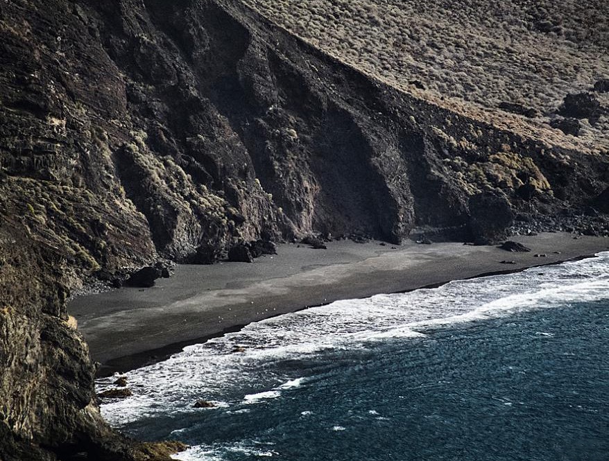 Zdjęcie Playa de Heredia z powierzchnią szary kamyk