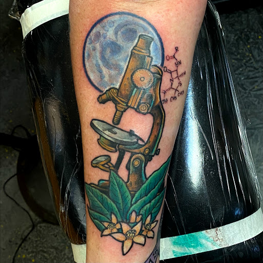 Explore tricep tattoo ideas for guys, creative tattoo ideas in Helena, available at Velvet Rose Tattoo