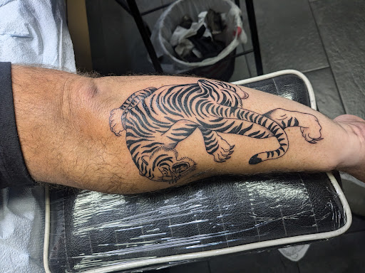 Explore calf tattoo ideas, creative tattoo ideas in Summerville, available at Blackwater Tattoo Co.