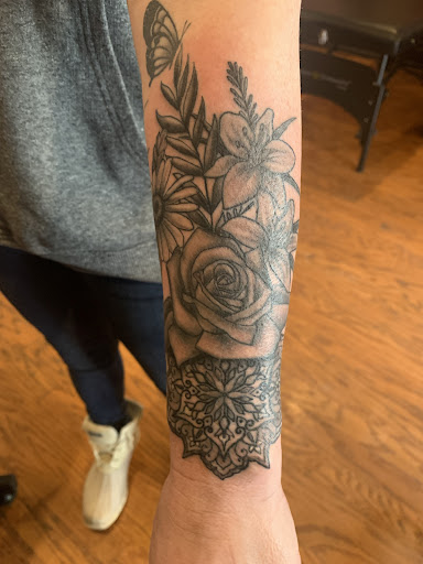 Explore colour tattoo sleeve ideas, creative tattoo ideas in Cass City, available at Wolf Zen Tattoo