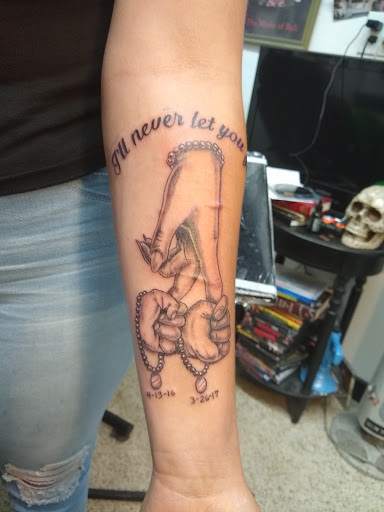 Explore tattoo ideas for football, creative tattoo ideas in Wilmington, available at Hardwire Tattoo & Body Piercing