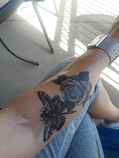 Explore middle neck tattoo ideas, creative tattoo ideas in Pearland, available at Black List Tattoo & Piercing Co.
