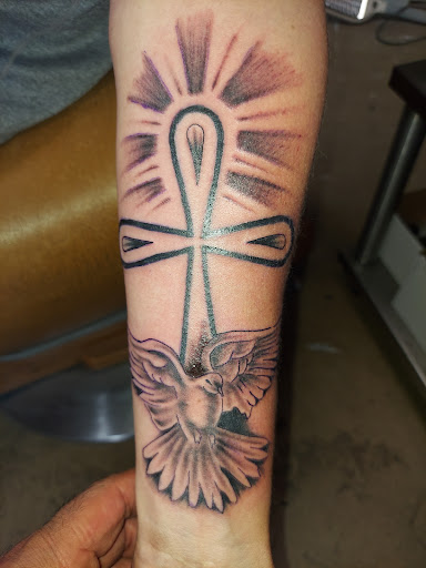 Explore mens inner bicep tattoo ideas, creative tattoo ideas in Odessa, available at Little Dragon Tattoos Studio