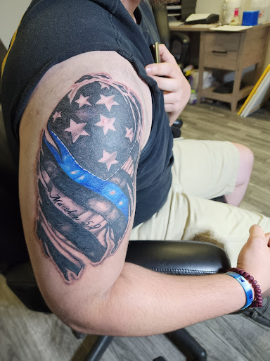 Explore hunger games tattoo ideas, creative tattoo ideas in Sioux City, available at Tattoo Monkey