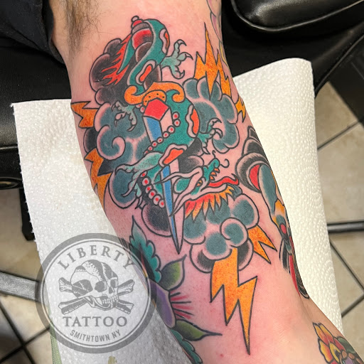 Explore roman numeral tattoo ideas, creative tattoo ideas in Smithtown, available at Liberty Tattoo Co Inc