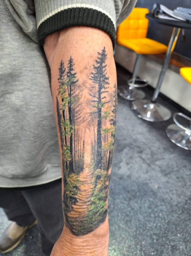 Explore dark skin male black skin tattoo ideas, creative tattoo ideas in Slippery Rock, available at Dinky Dachshund Tattoo Parlor