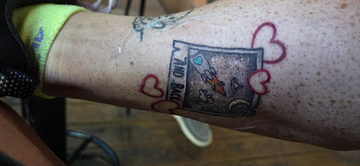 Explore dog tag tattoo ideas, creative tattoo ideas in Sevierville, available at Jaded Art Collective