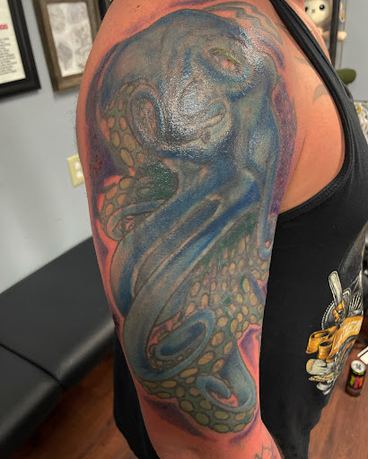 Explore mens quad tattoo ideas, creative tattoo ideas in Augusta, available at Allegiance Ink Tattoo