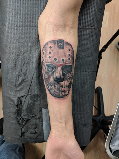 Explore trust no one tattoo ideas, creative tattoo ideas in Kenosha, available at Kenosha Tattoo Company