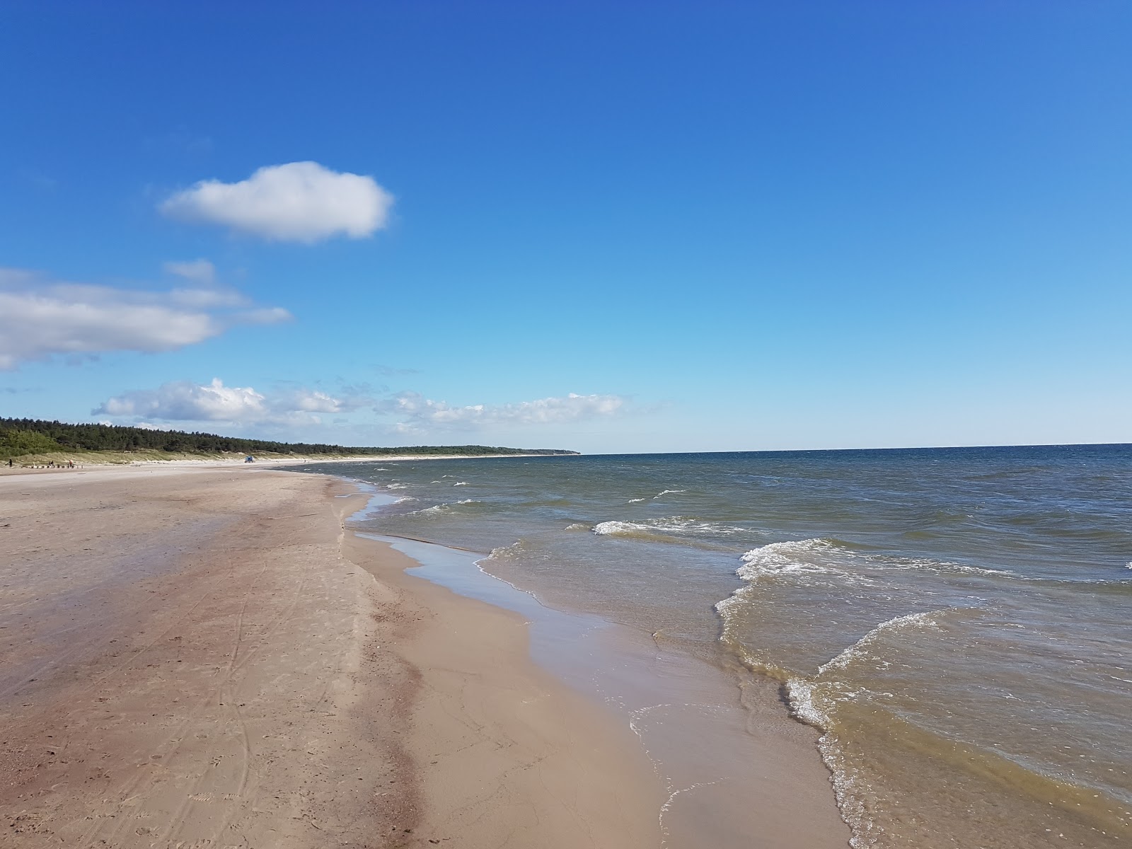 Foto av Nemirsetos pliazas II med turkosa vatten yta