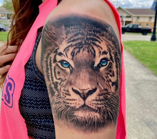 Explore behind ear tattoo ideas for guys, creative tattoo ideas in Rockford, available at Euro Tattoo