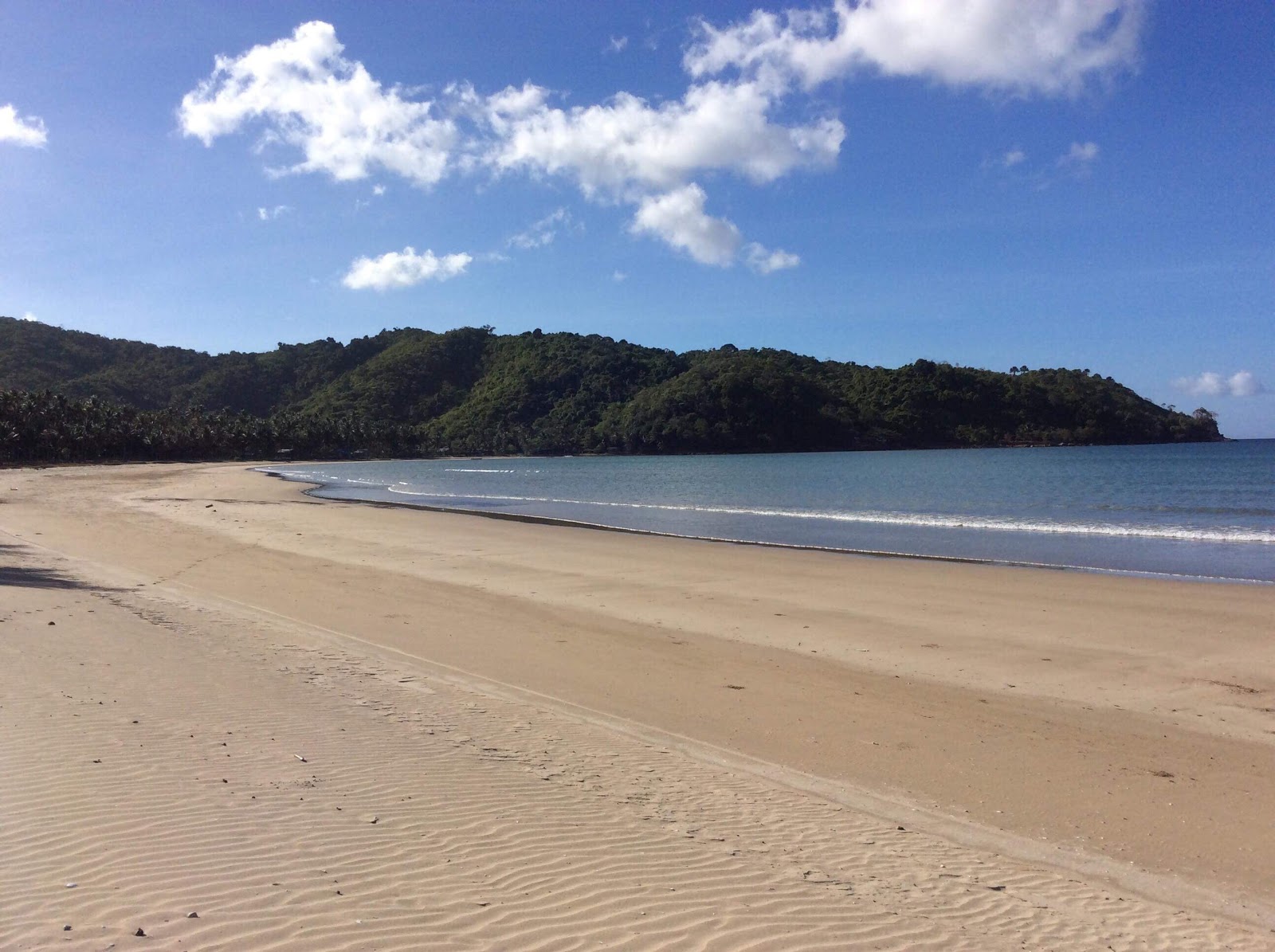 Photo de Bucana Beach avec sable lumineux de surface