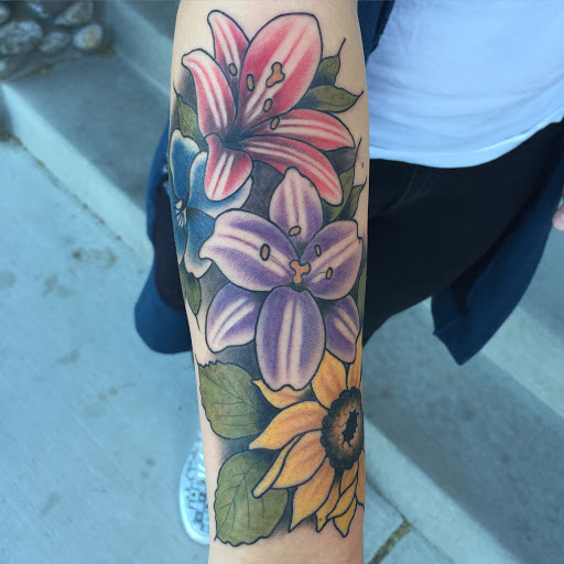 Explore lion forearm tattoo ideas, creative tattoo ideas in Reno, available at Aces Tattoo