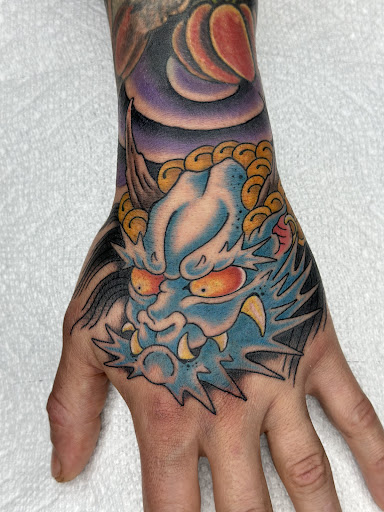 Explore skull hand tattoo ideas, creative tattoo ideas in Glenwood Springs, available at Hole In the Wall Tattoos and Piercing, LLC