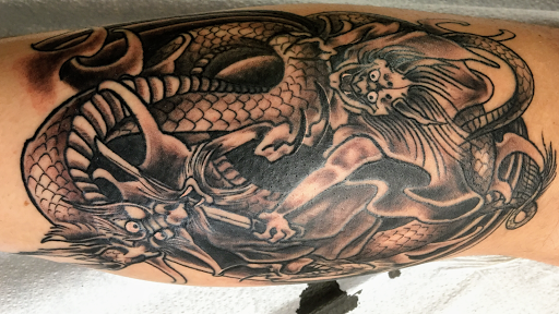 Explore lung cancer ribbon tattoo ideas, creative tattoo ideas in Chapel Hill, available at Golden Falcon Tattoo and Piercing