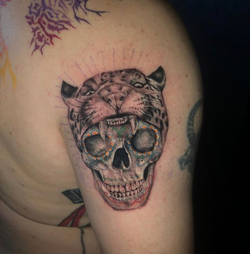 Explore tramp stamp tattoos ideas, creative tattoo ideas in Odessa, available at Black Cat Tattoo Company