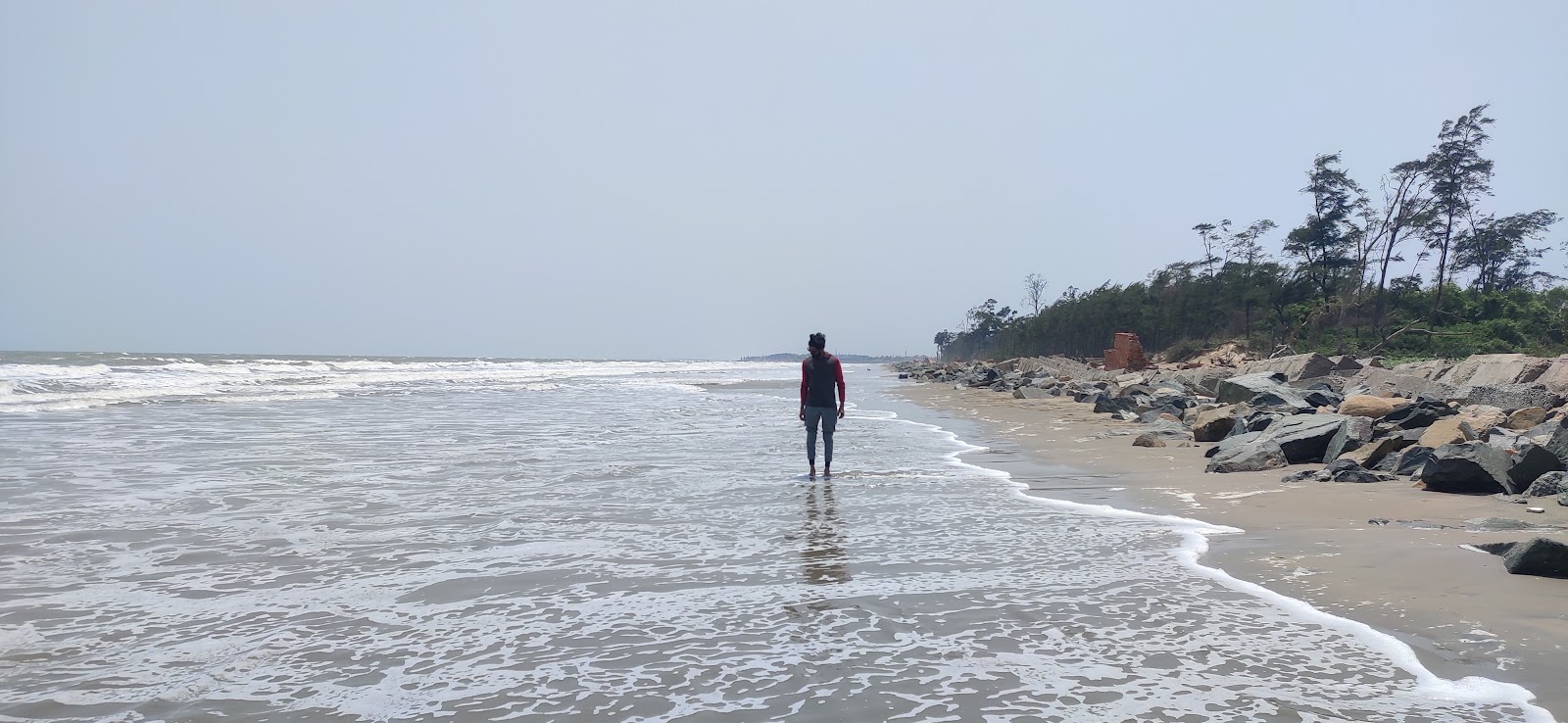 Zdjęcie Kiagoria Beach z powierzchnią jasny piasek