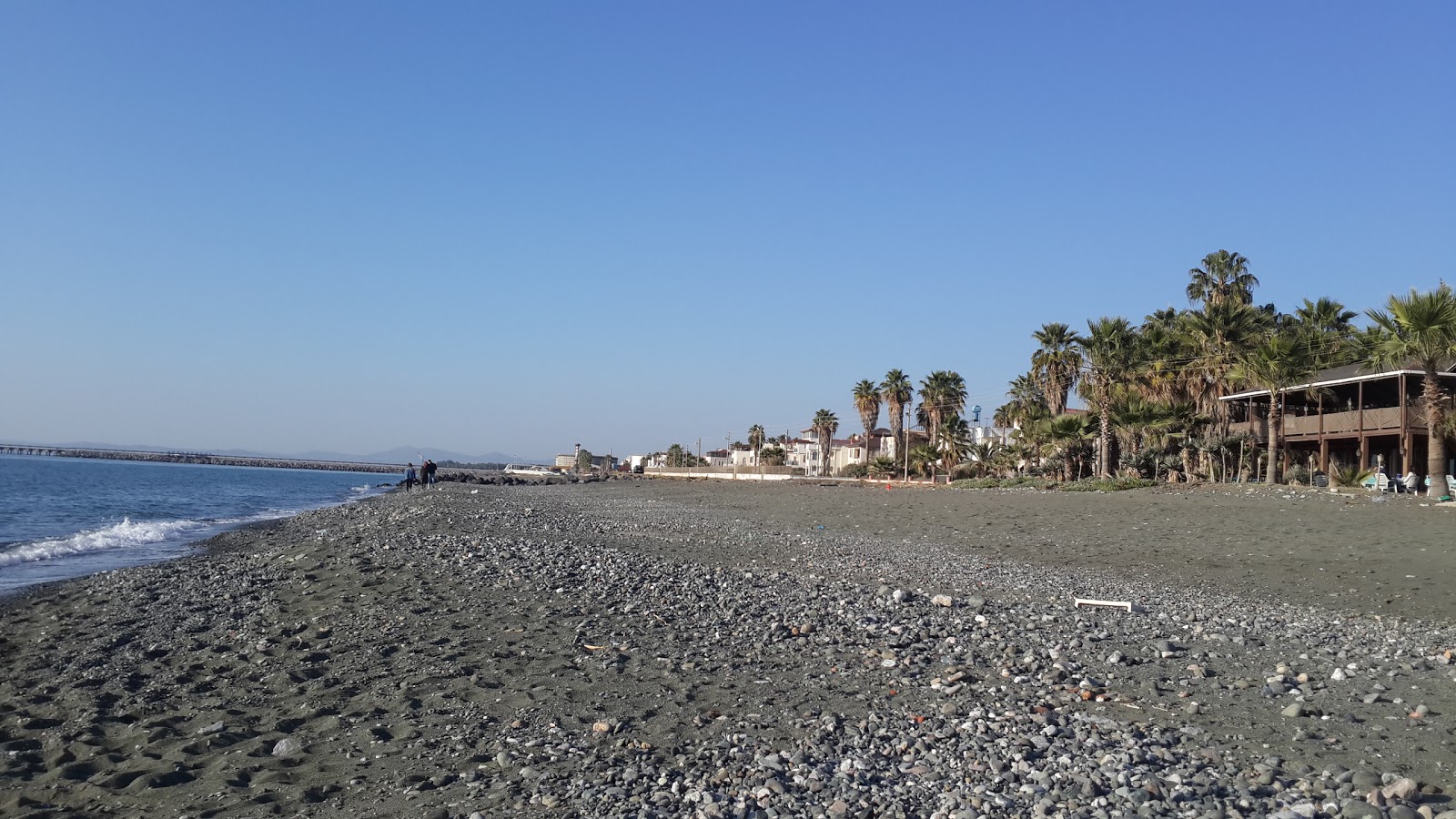 Φωτογραφία του Burnaz beach με γκρι άμμος και βότσαλα επιφάνεια
