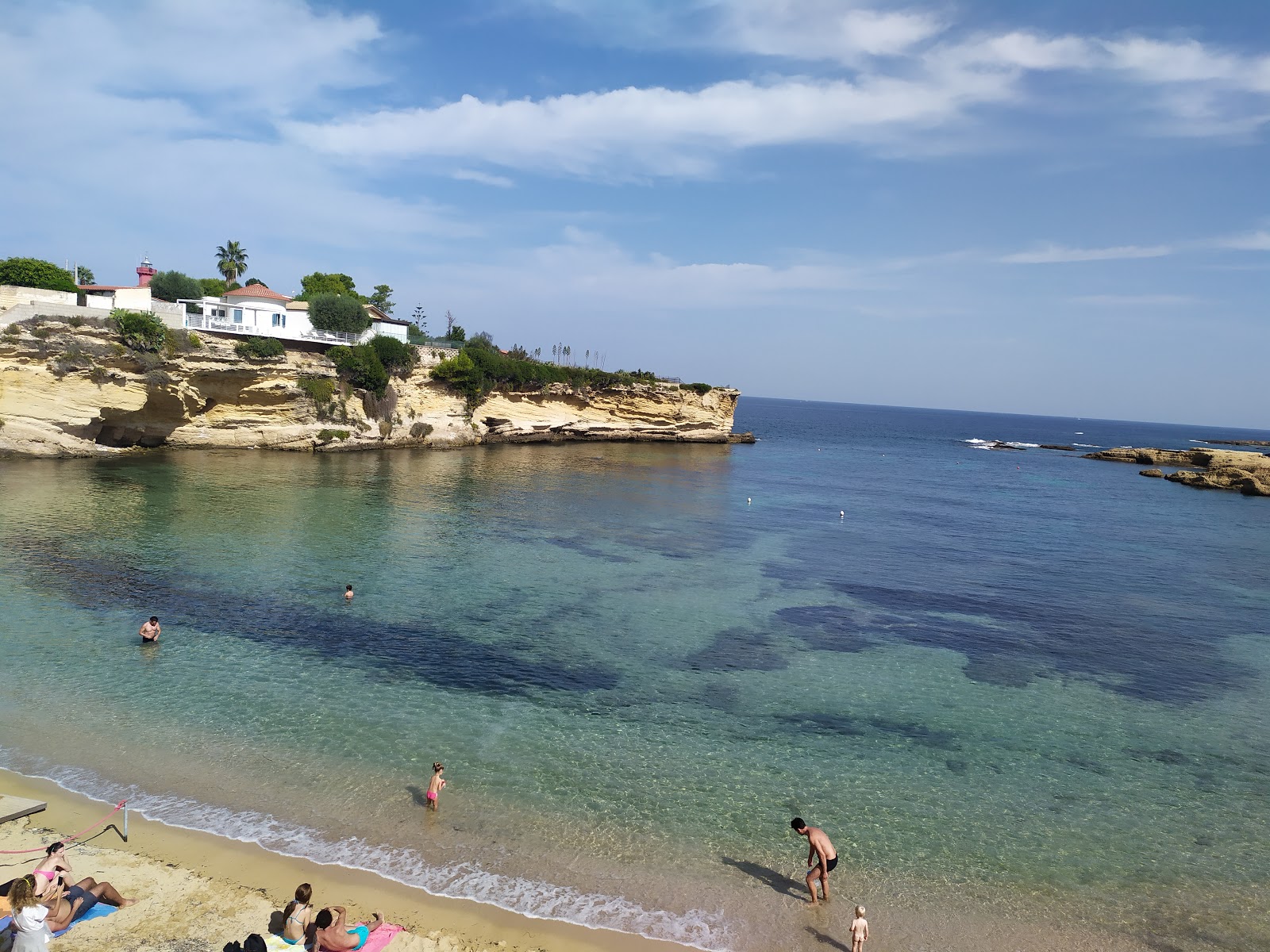 Spiaggia del Minareto的照片 带有碧绿色纯水表面