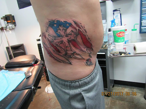 Explore cute dinosaur tattoo ideas, creative tattoo ideas in Enid, available at IRONHORSE TATTOO & BODY PIERCING STUDIO,LLC