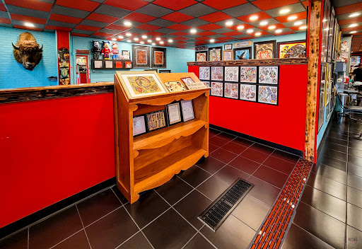 Explore simple thigh tattoo ideas, creative tattoo ideas in Utica, available at Big Top Tattoo