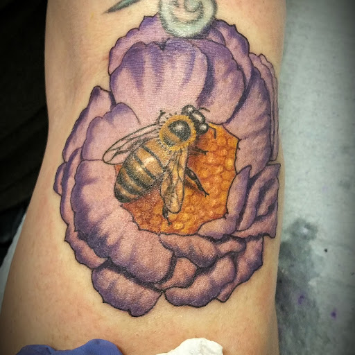 Explore thigh flower tattoo ideas, creative tattoo ideas in Durham, available at Skin City Body Art