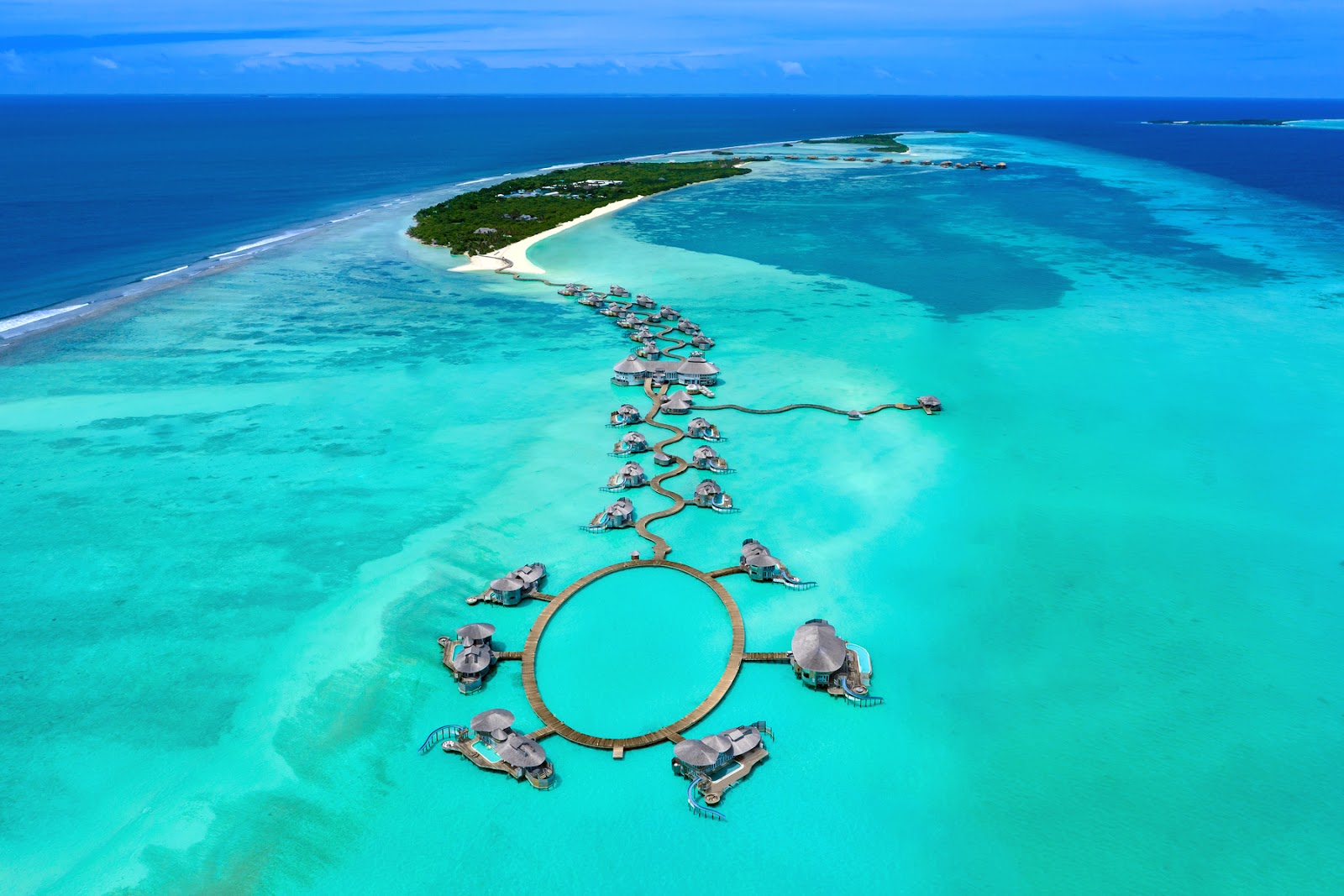 Photo of Soneva Jani island with turquoise pure water surface