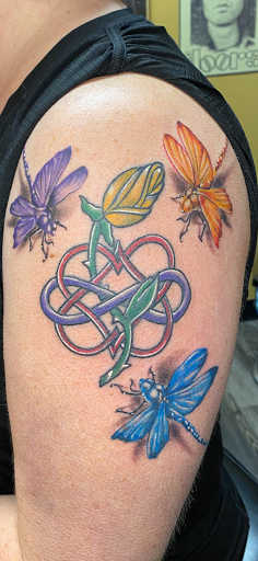 Explore fantasy book tattoo ideas, creative tattoo ideas in Warner Robins, available at Untold Pain Tattoo Studio