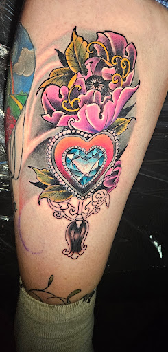 Explore tattoo ideas broken heart, creative tattoo ideas in Angola, available at Hoodlum Ink