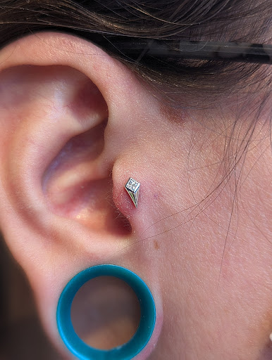 Explore neck tattoos ideas, creative tattoo ideas in Eau Claire, available at Steel N Ink Body Piercing